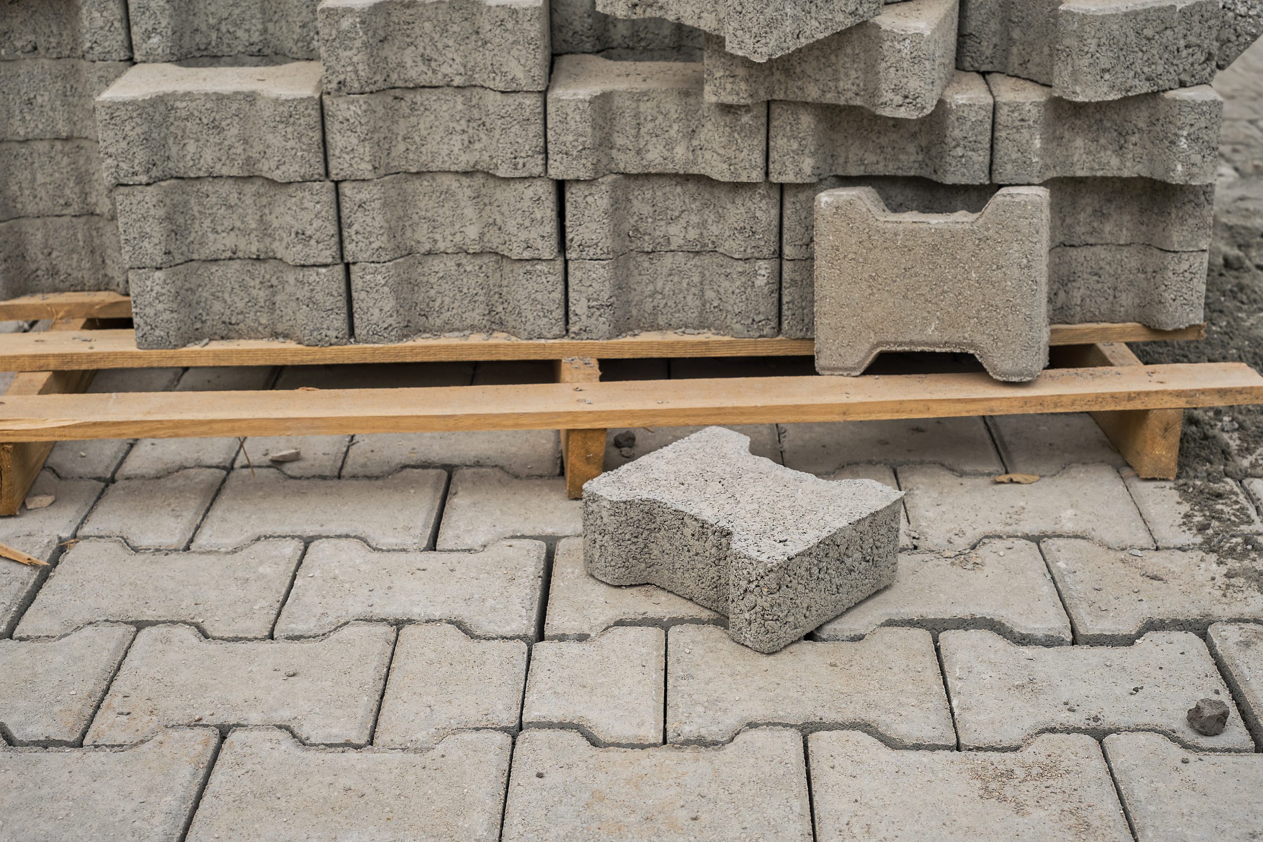 Concrete pavers and materials for pool deck installation